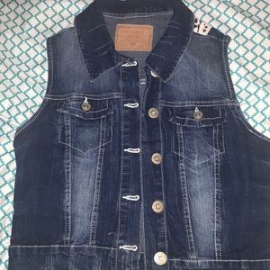 jean jacket with lace design in the back.